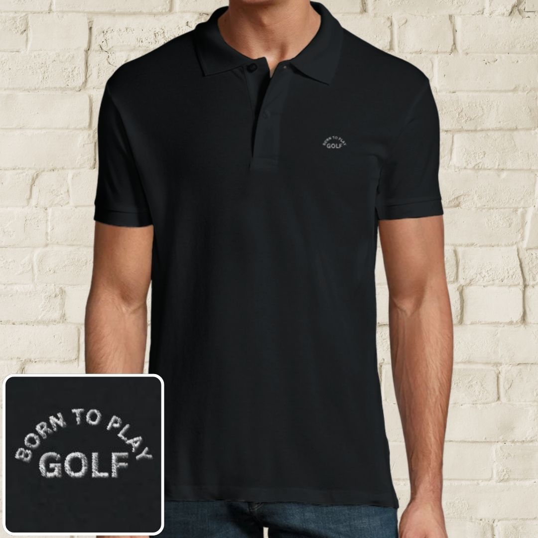 Born Polo in Black on a light wooden floor lying next to headphones and golf shoes.