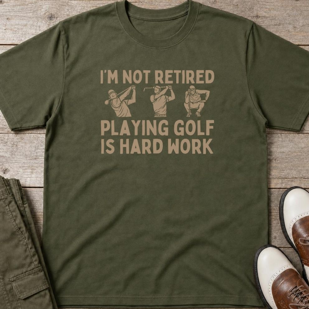 Hard Work T-Shirt in Military Green lying on a plain floor. T-shirt is a unisex cut and 100 per cent cotton.
