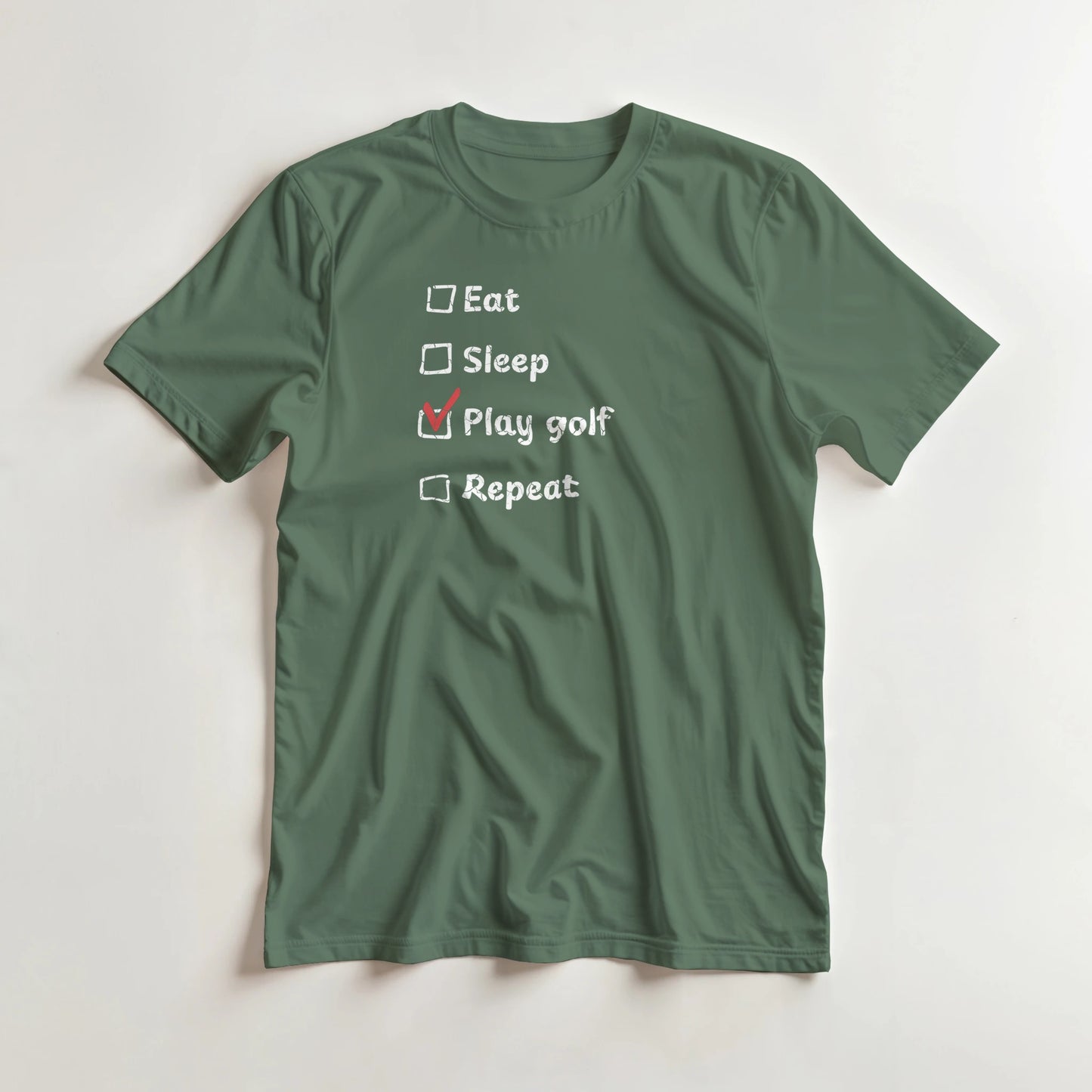 Golf Repeat T-Shirt in Military Green lying on a plain floor. T-shirt is a unisex cut and 100 per cent cotton.