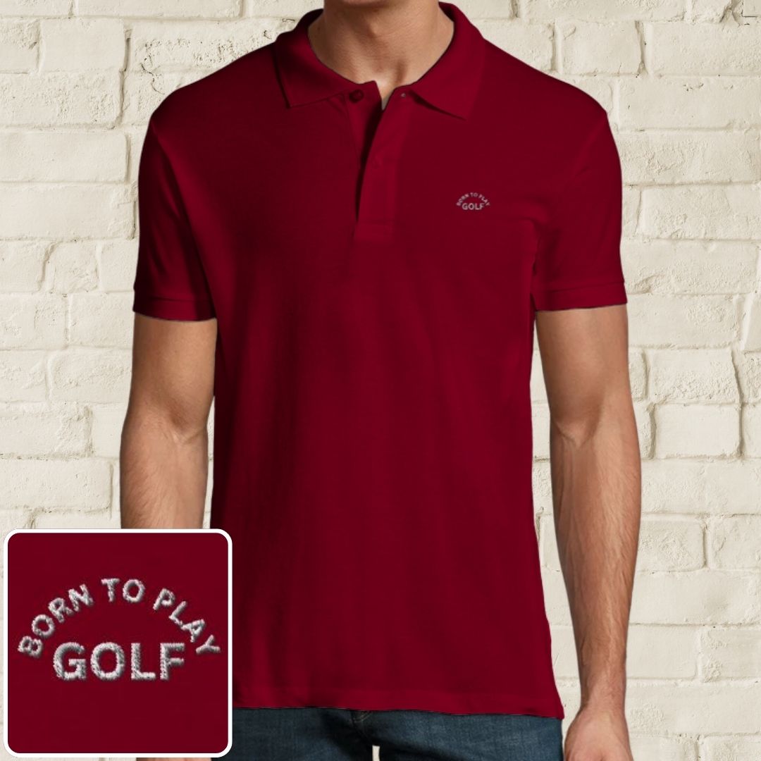 Born Polo in Maroon on a light wooden floor lying next to headphones and golf shoes.
