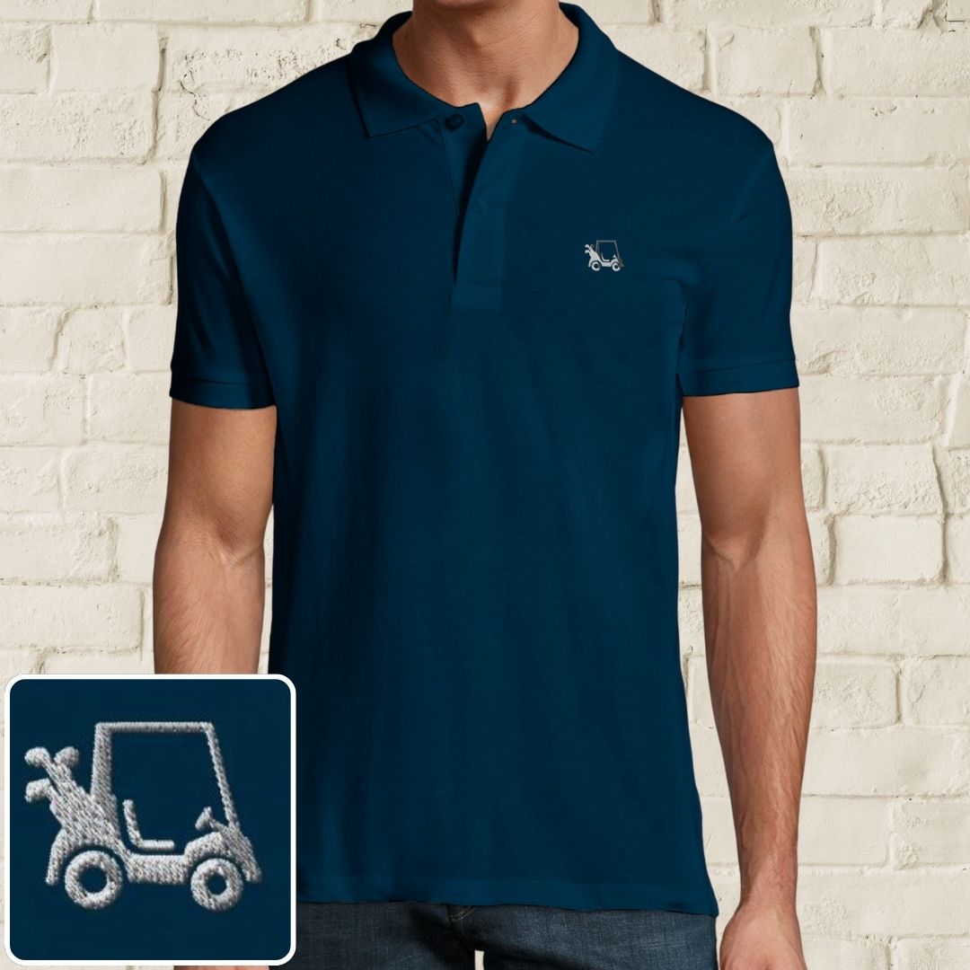 Golf Cart Polo in Denim on a light wooden floor lying next to headphones and golf shoes.