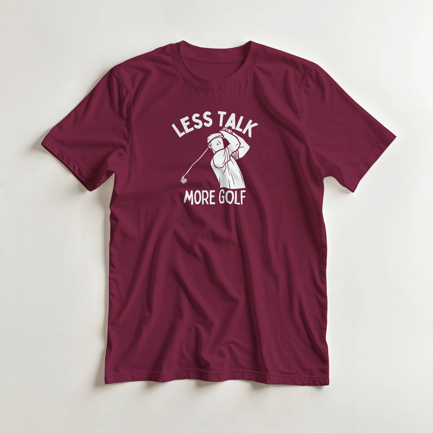 Less Talk T-Shirt in Maroon lying on a plain floor. T-shirt is a unisex cut and 100 per cent cotton.