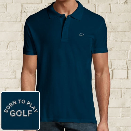 Born Polo in Denim on a light wooden floor lying next to headphones and golf shoes.