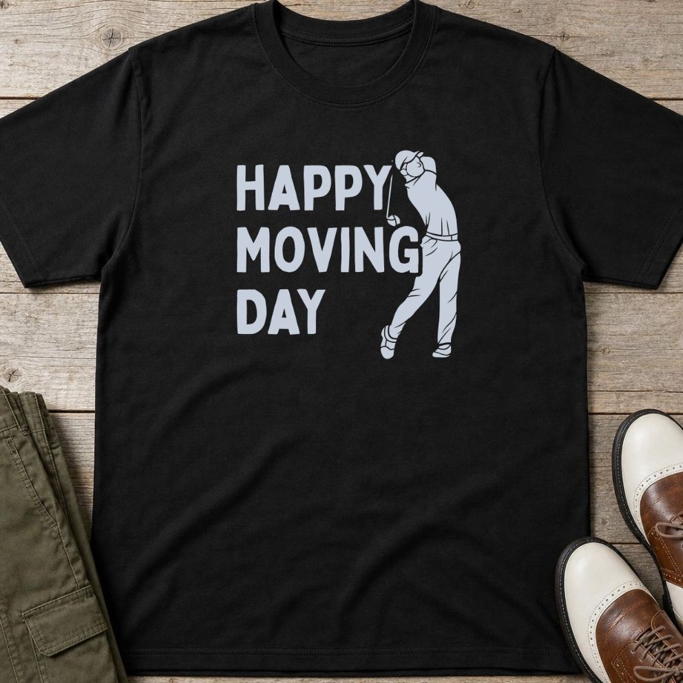 Happy Moving Day T-Shirt in Black lying on a plain floor. T-shirt is a unisex cut and 100 per cent cotton.