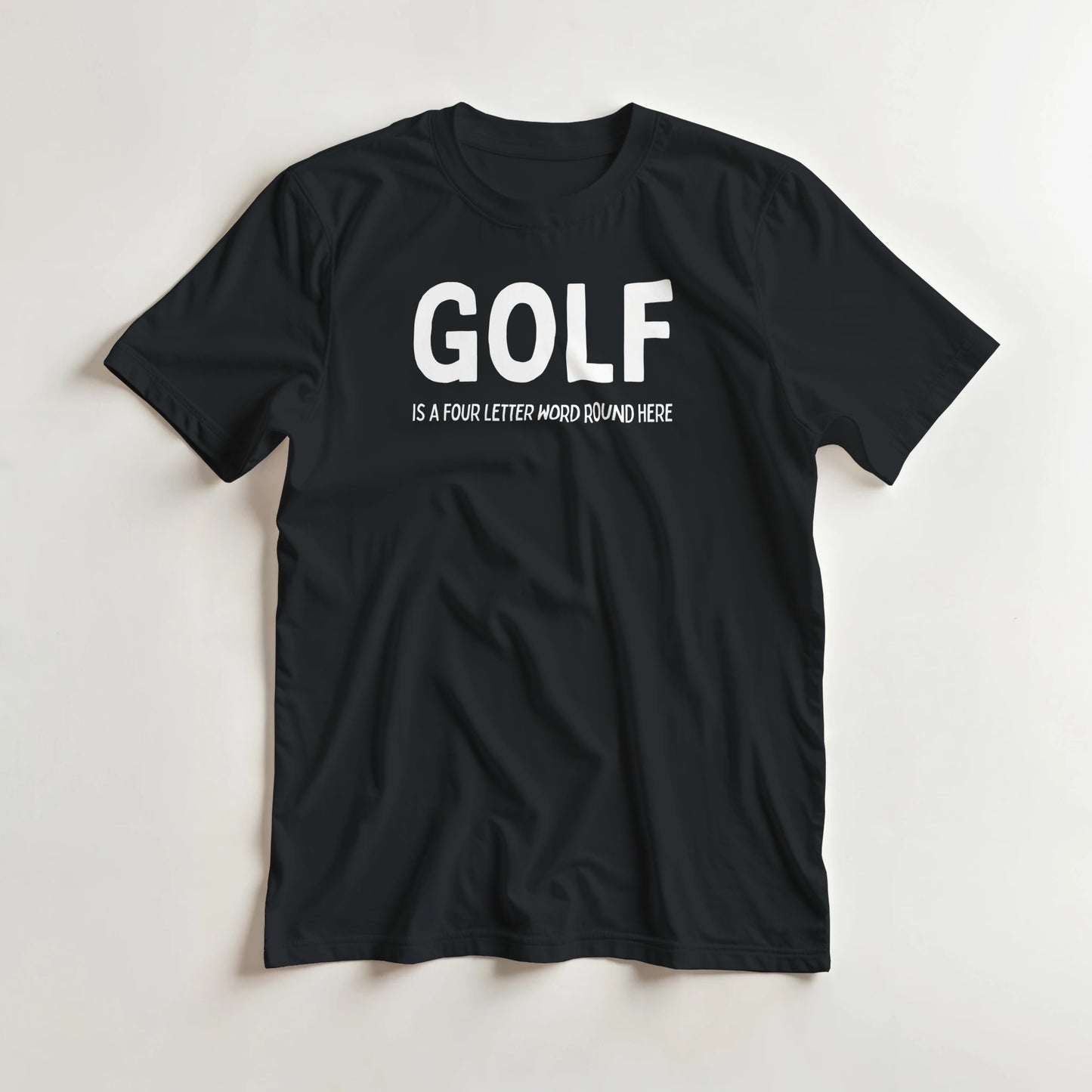 Four Letter Word T-Shirt in Black lying on a plain floor. T-shirt is a unisex cut and 100 per cent cotton.