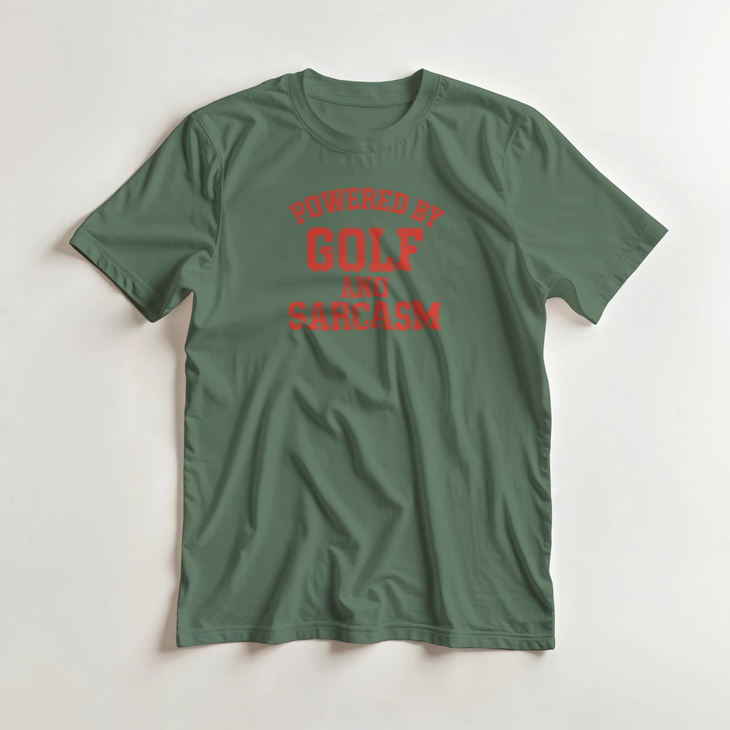 Powered By T-Shirt in Military Green lying on a plain floor. T-shirt is a unisex cut and 100 per cent cotton.