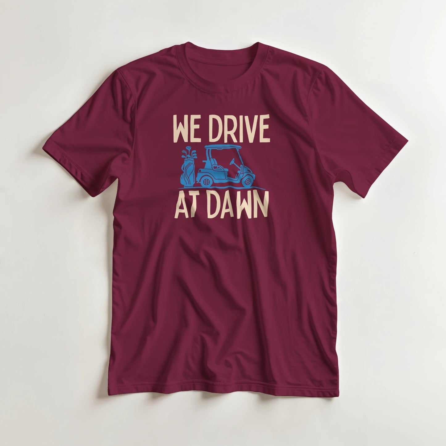 Drive At Dawn Blue T-Shirt in Maroon lying on a plain floor. T-shirt is a unisex cut and 100 per cent cotton.