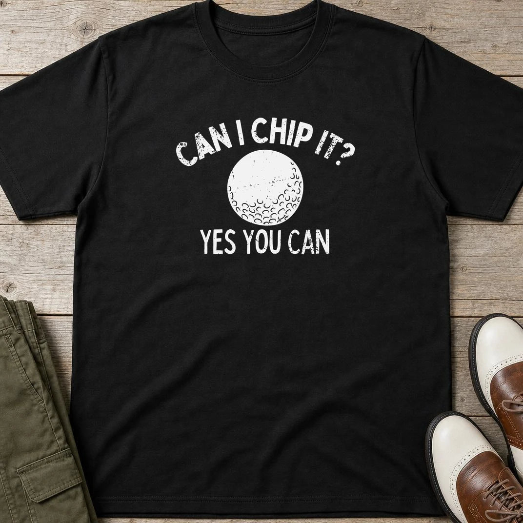 Can I Chip It T-Shirt in Black lying on a plain floor. T-shirt is a unisex cut and 100 per cent cotton.