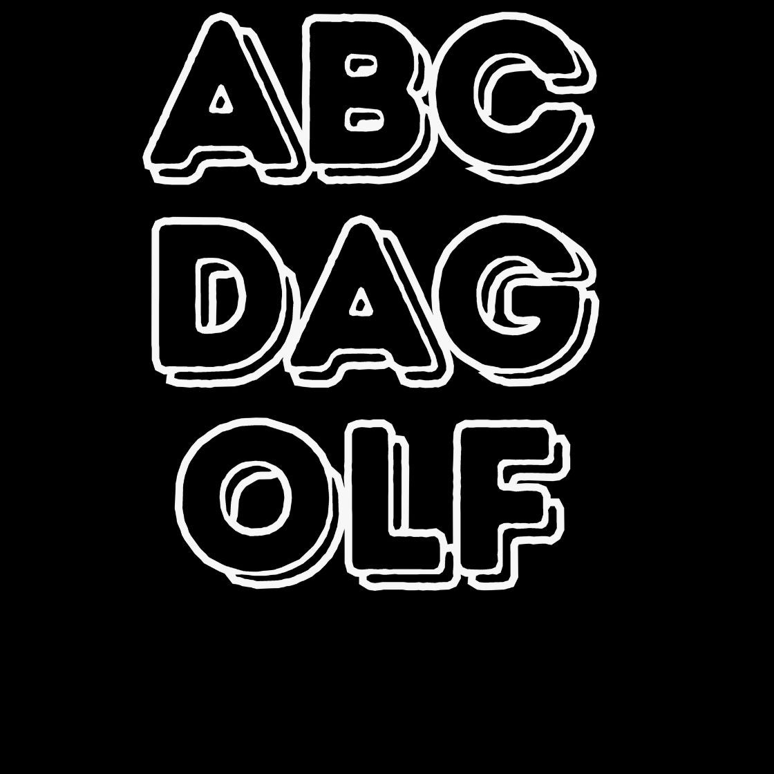 ABC Da Golf T-Shirt in on a light wooden floor lying next to headphones and golf shoes.