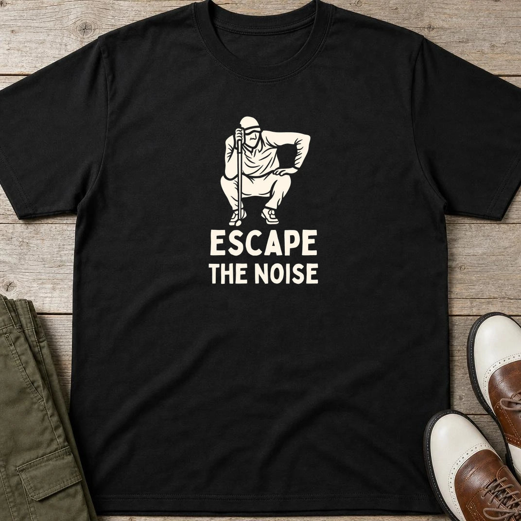 Escape T-Shirt in Black lying on a plain floor. T-shirt is a unisex cut and 100 per cent cotton.