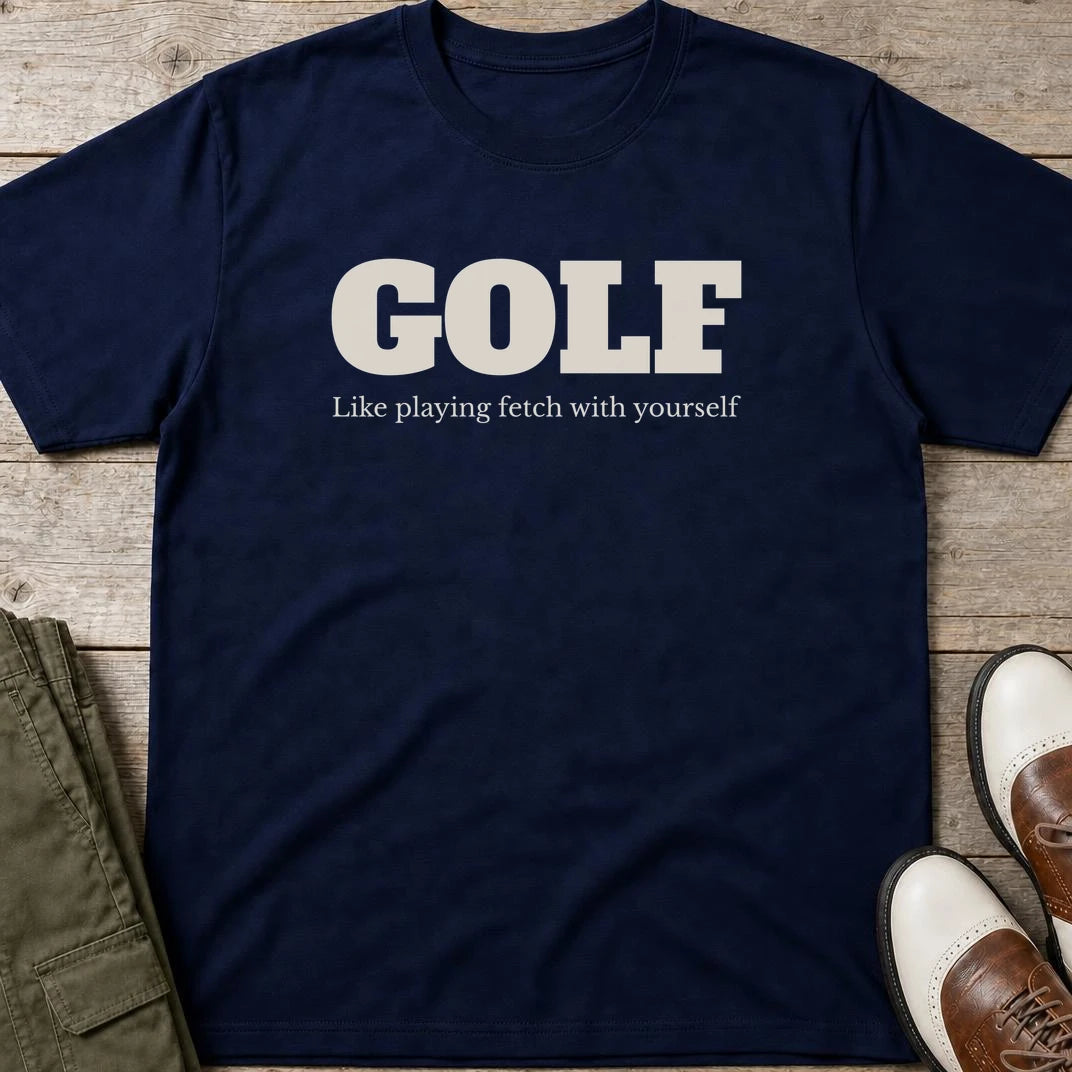 Fetch T-Shirt in Black lying on a plain floor. T-shirt is a unisex cut and 100 per cent cotton.
