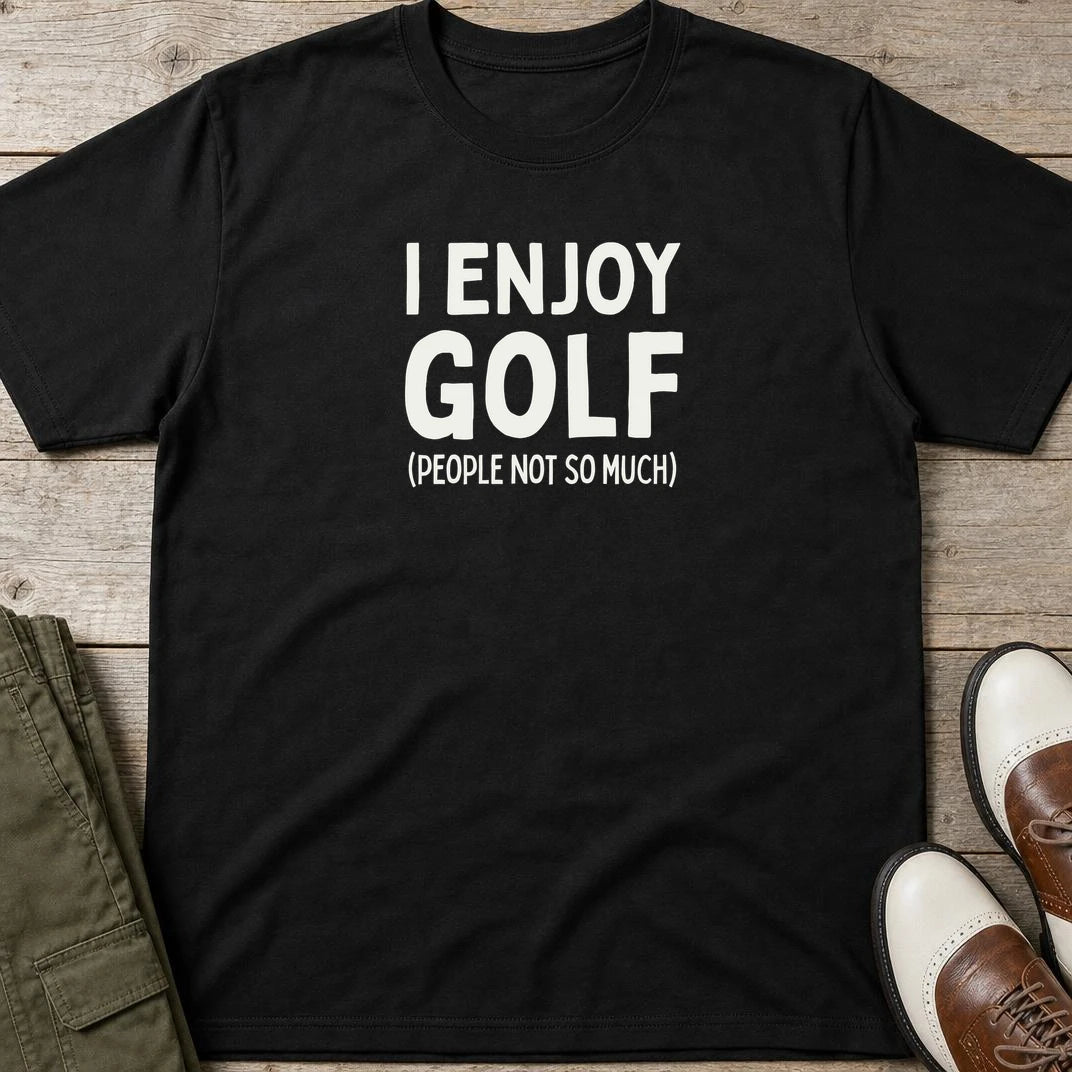 I Enjoy Golf T-Shirt in Black lying on a plain floor. T-shirt is a unisex cut and 100 per cent cotton.