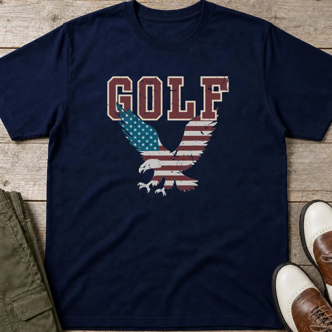 Golf USA Eagle T-Shirt in Navy lying on a plain floor. T-shirt is a unisex cut and 100 per cent cotton.