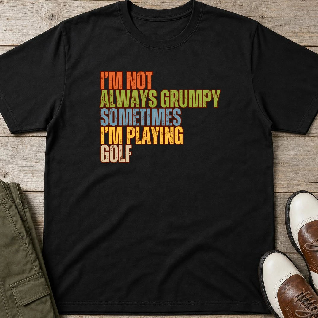 Grumpy Classic T-Shirt in Black lying on a plain floor. T-shirt is a unisex cut and 100 per cent cotton.