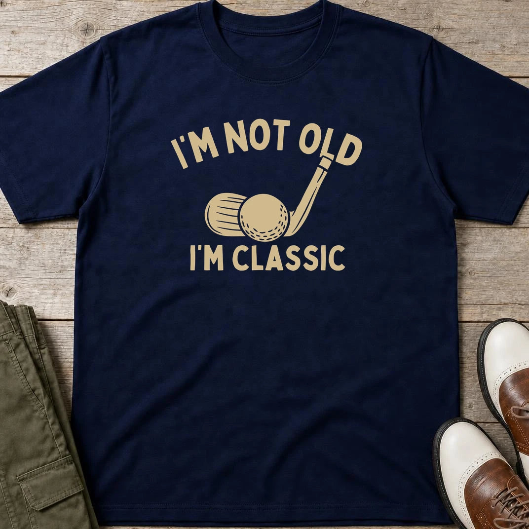 I'm Classic T-Shirt in Navy lying on a plain floor. T-shirt is a unisex cut and 100 per cent cotton.