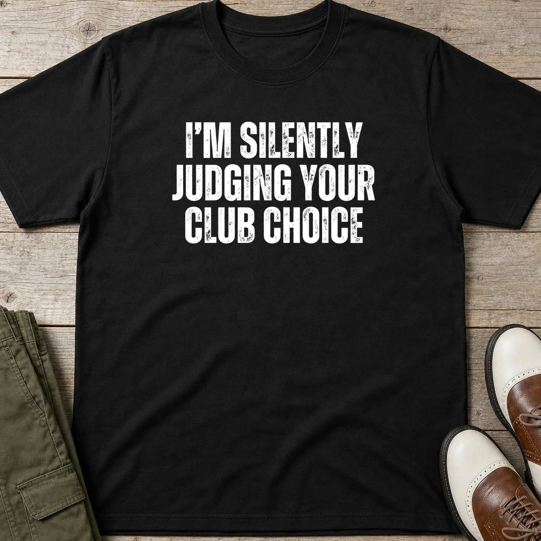 Silently Judging T-Shirt in Black lying on a plain floor. T-shirt is a unisex cut and 100 per cent cotton.