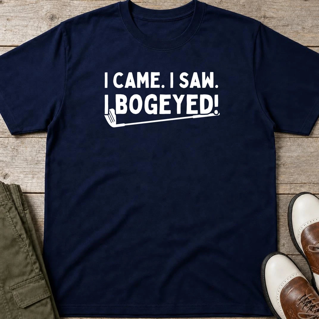 Bogeyed T-Shirt in Navy lying on a plain floor. T-shirt is a unisex cut and 100 per cent cotton.