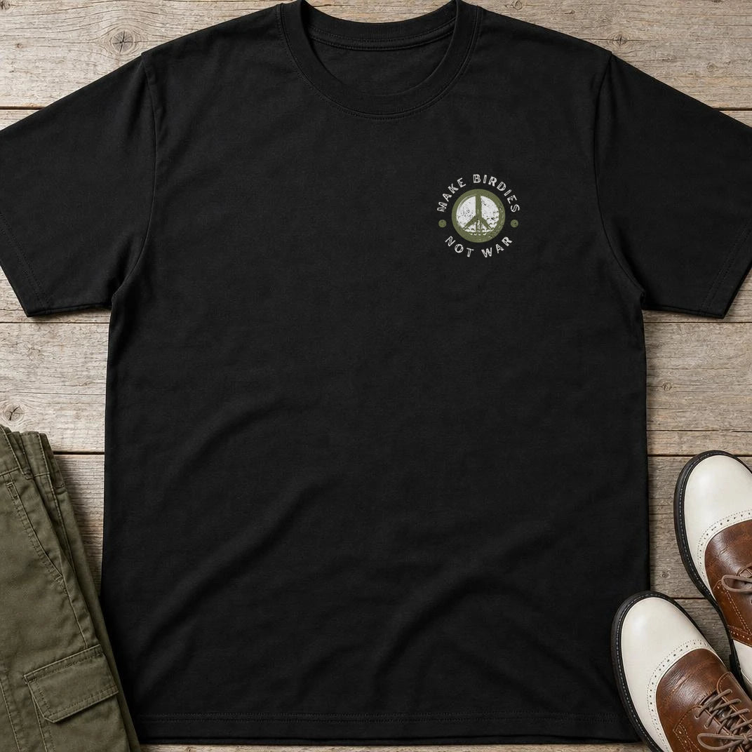 Make Birdies Pocket T-Shirt in Black lying on a plain floor. T-shirt is a unisex cut and 100 per cent cotton.
