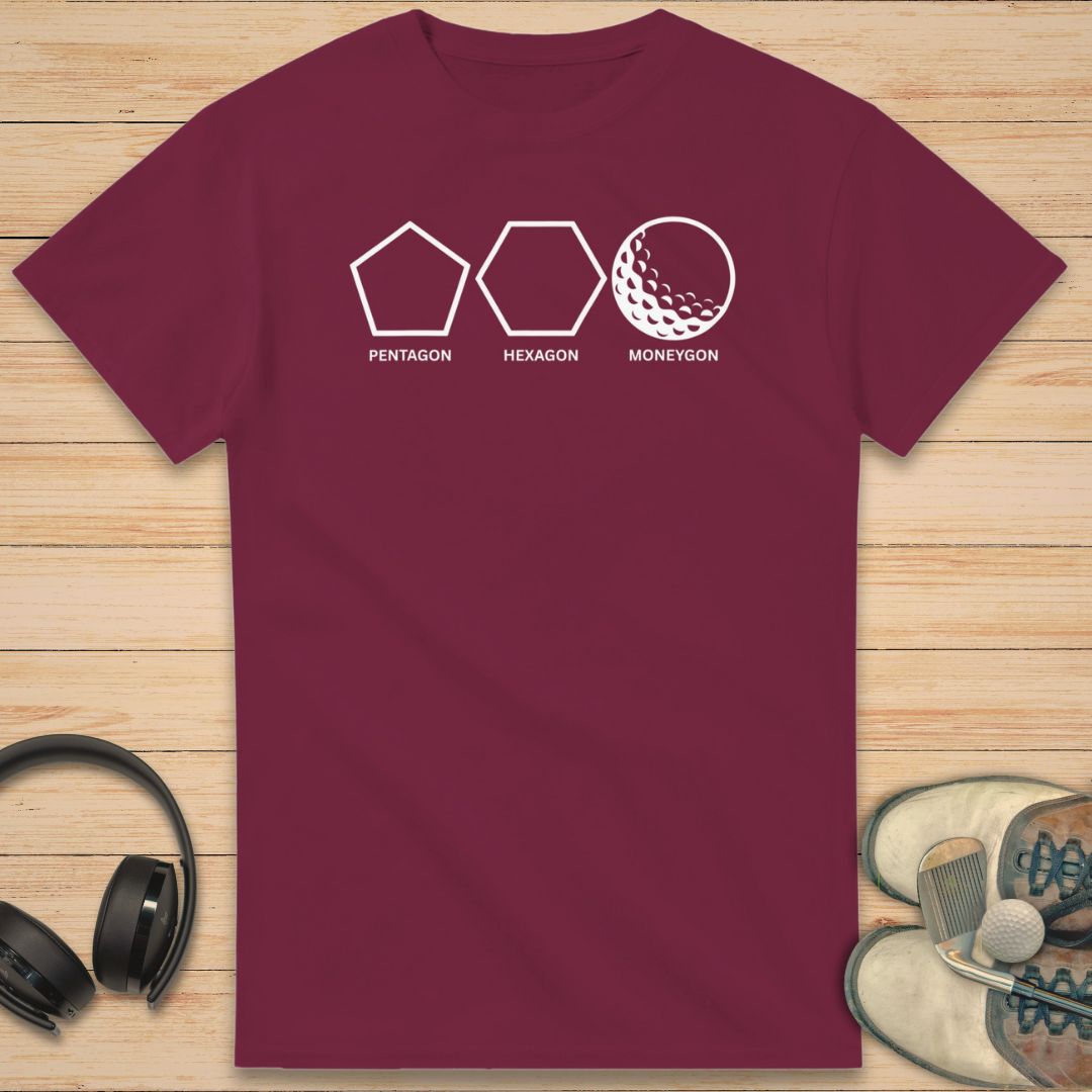 Moneygon T-Shirt in Maroon on a light wooden floor lying next to headphones and golf shoes.