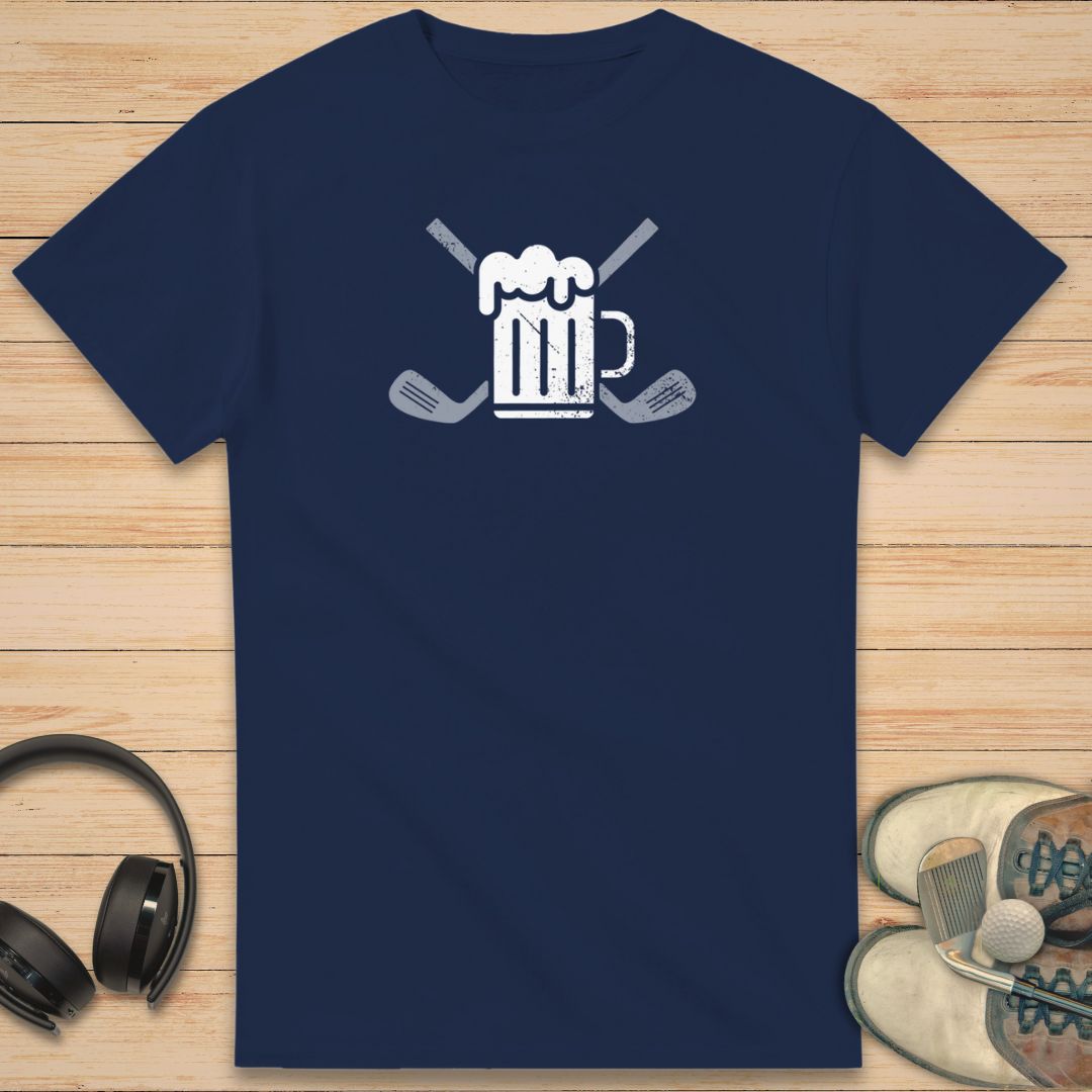 Beer Club T-Shirt in Navy on a light wooden floor lying next to headphones and golf shoes.