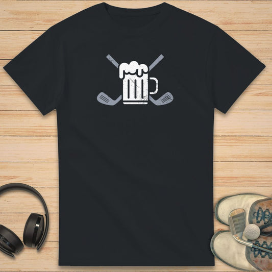 Beer Club T-Shirt in Black on a light wooden floor lying next to headphones and golf shoes.