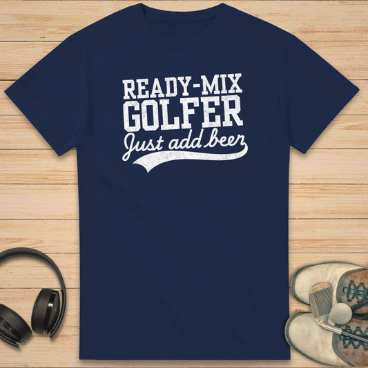 Ready-Mix T-Shirt in Navy on a light wooden floor lying next to headphones and golf shoes.