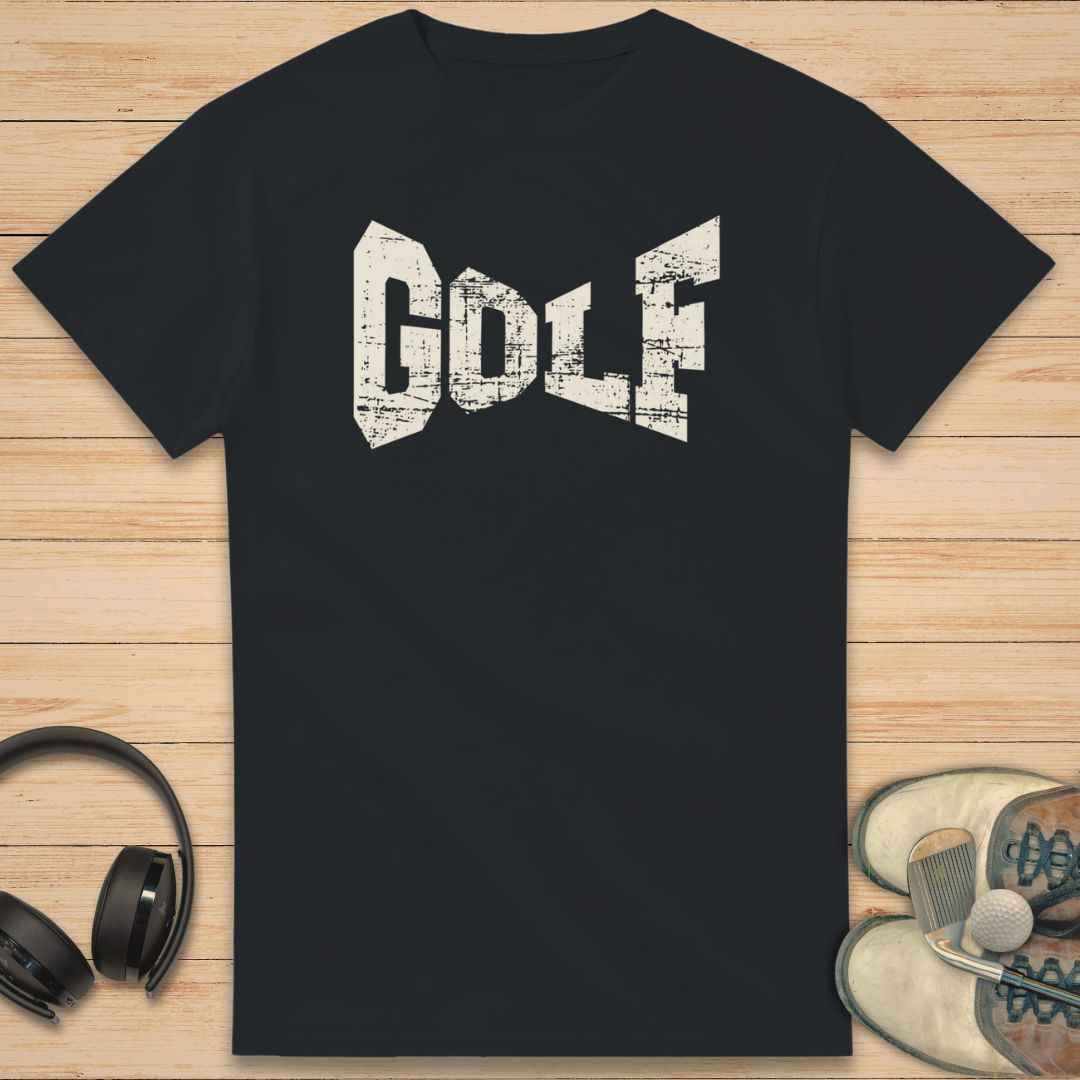 Black t-shirt with 'GOLF' text on a wooden surface with headphones and sneakers.
