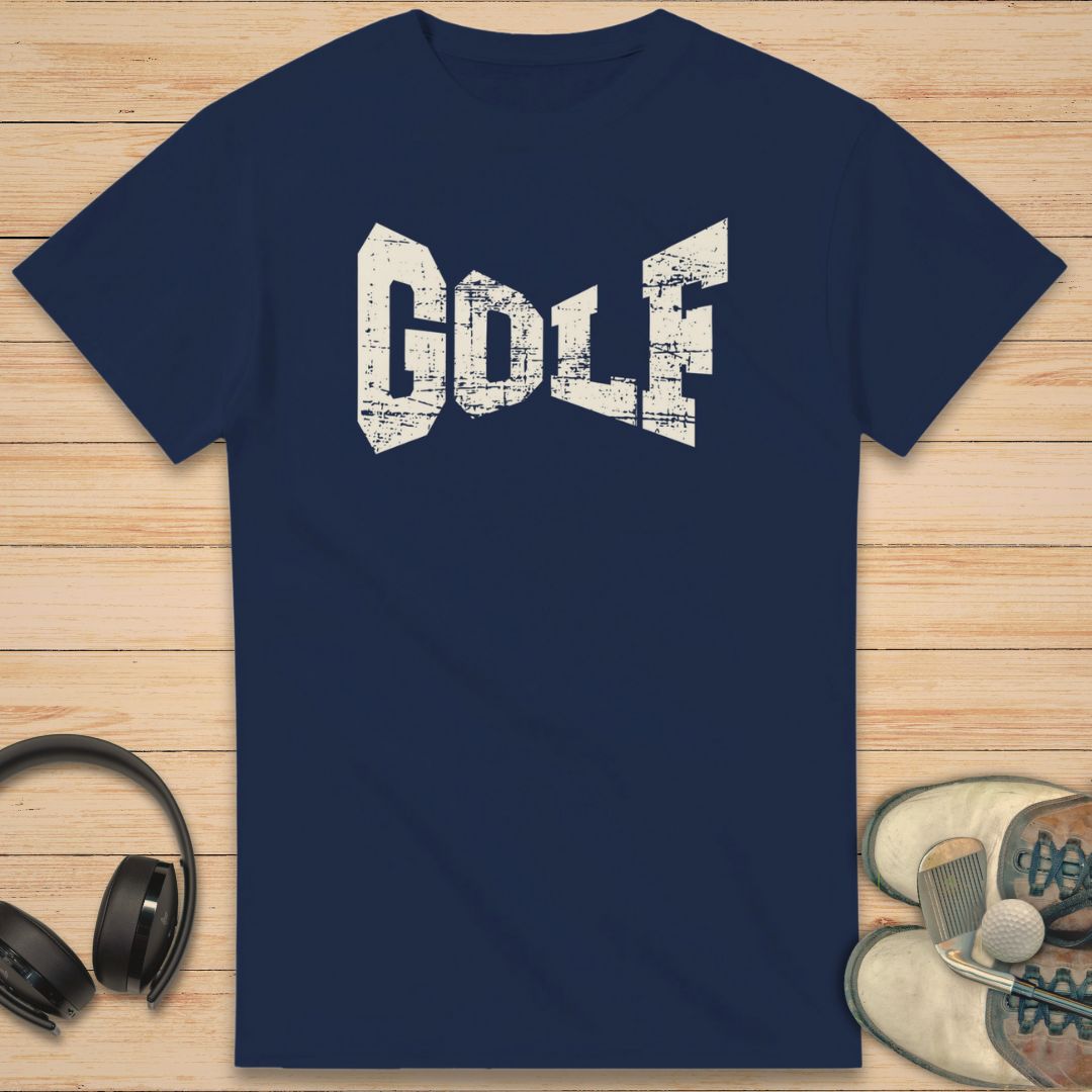 Navy blue t-shirt with 'GOLF' text on a wooden surface with headphones and sneakers.