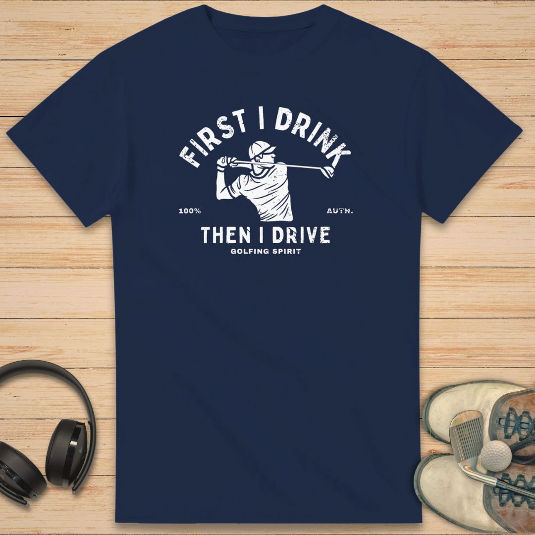 Golfing Spirit T-Shirt in Navy on a light wooden floor lying next to headphones and golf shoes.