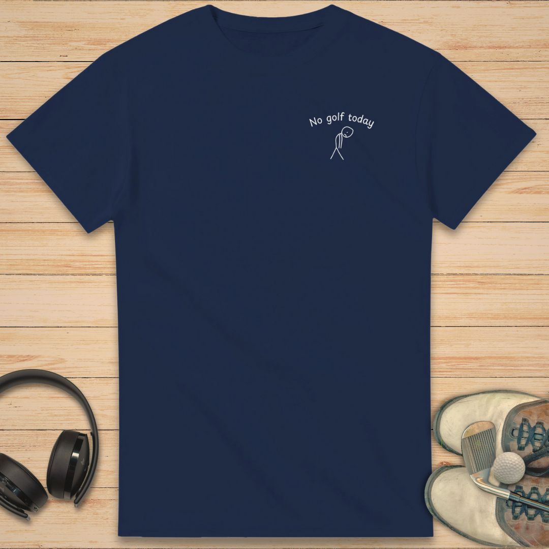 No Golf Today Pocket T-Shirt in Navy on a light wooden floor lying next to headphones and golf shoes.