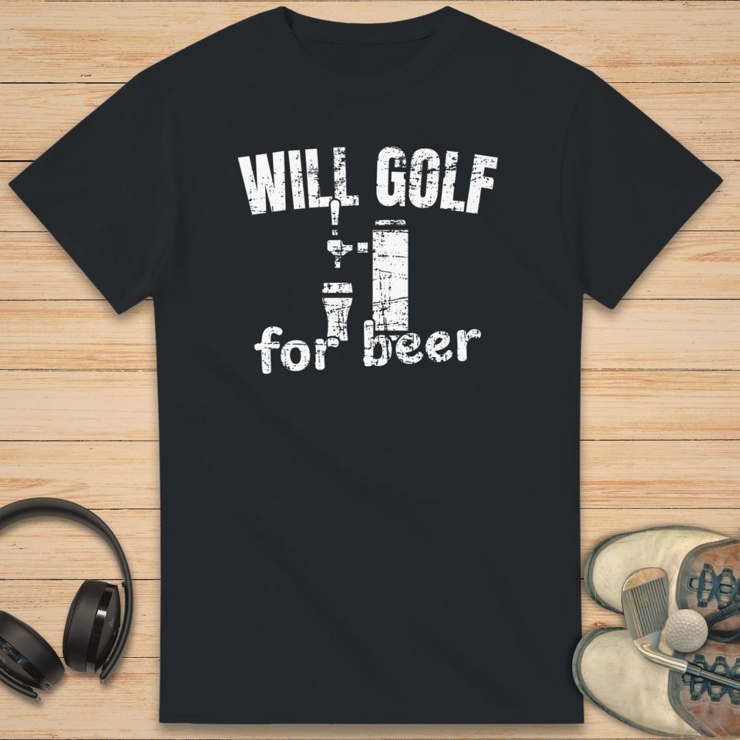 For Beer T-Shirt in Black on a light wooden floor lying next to headphones and golf shoes.