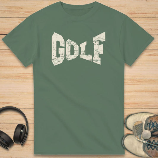Green t-shirt with 'GOLF' text on a wooden surface with headphones and shoes.