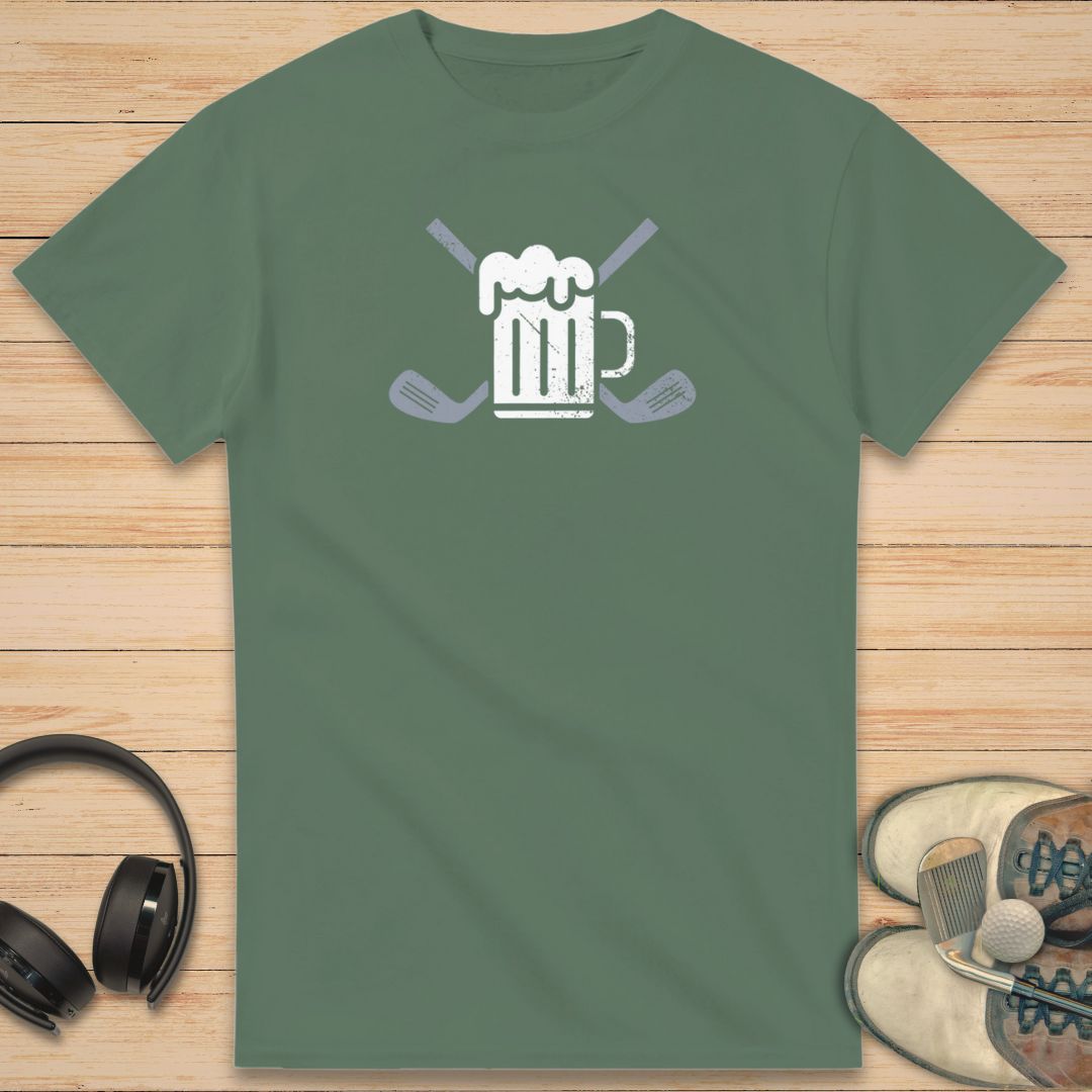 Beer Club T-Shirt in Military Green on a light wooden floor lying next to headphones and golf shoes.