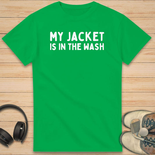 My Jacket T-Shirt in on a light wooden floor lying next to headphones and golf shoes.