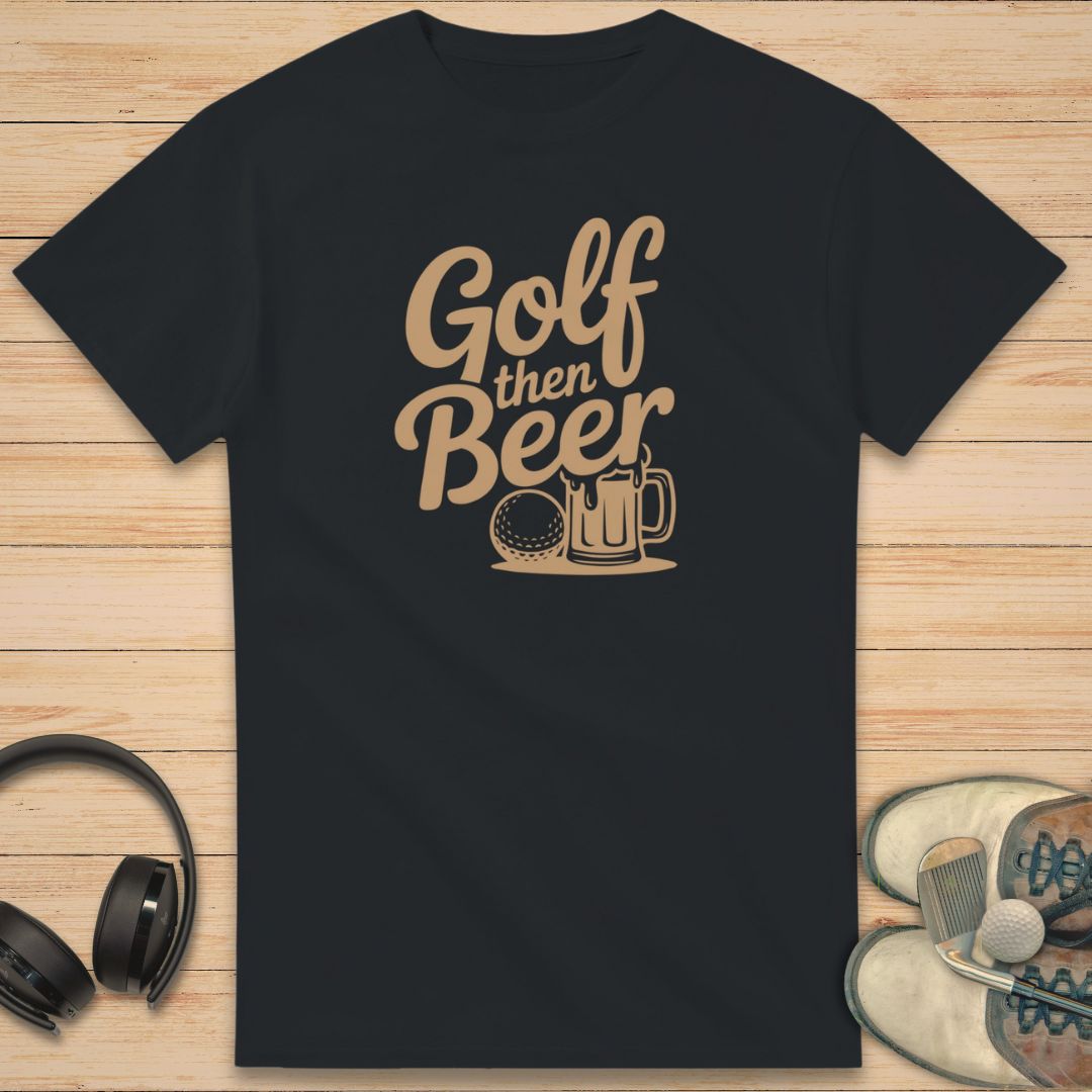 Golf Beer T-Shirt in Black on a light wooden floor lying next to headphones and golf shoes.