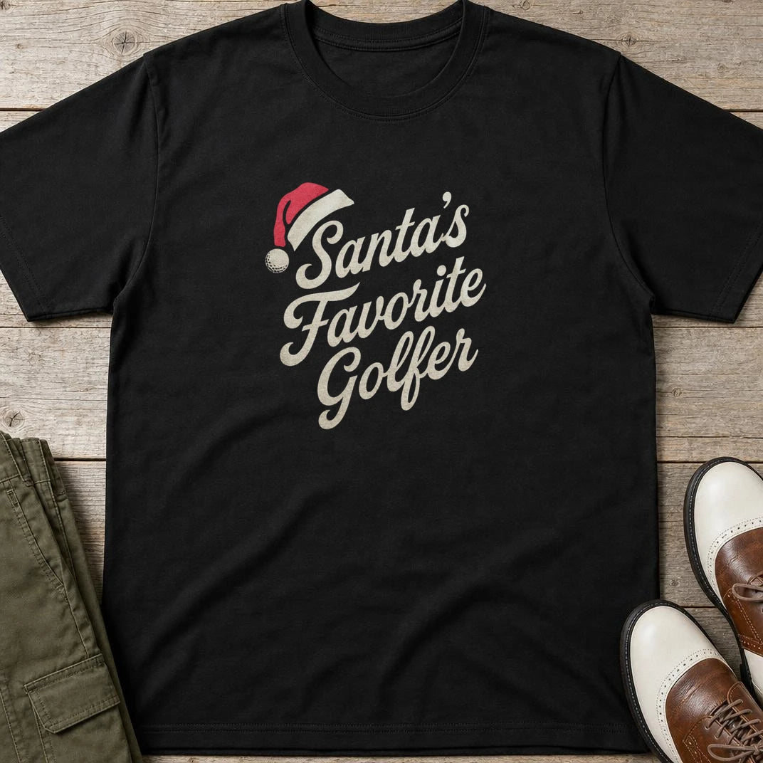 Santa's Favorite T-Shirt in Black lying on a plain floor. T-shirt is a unisex cut and 100 per cent cotton.