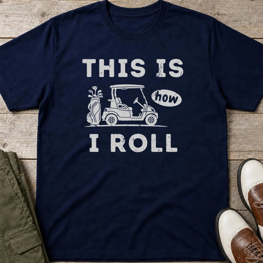 How I Roll T-Shirt in Navy lying on a plain floor. T-shirt is a unisex cut and 100 per cent cotton.
