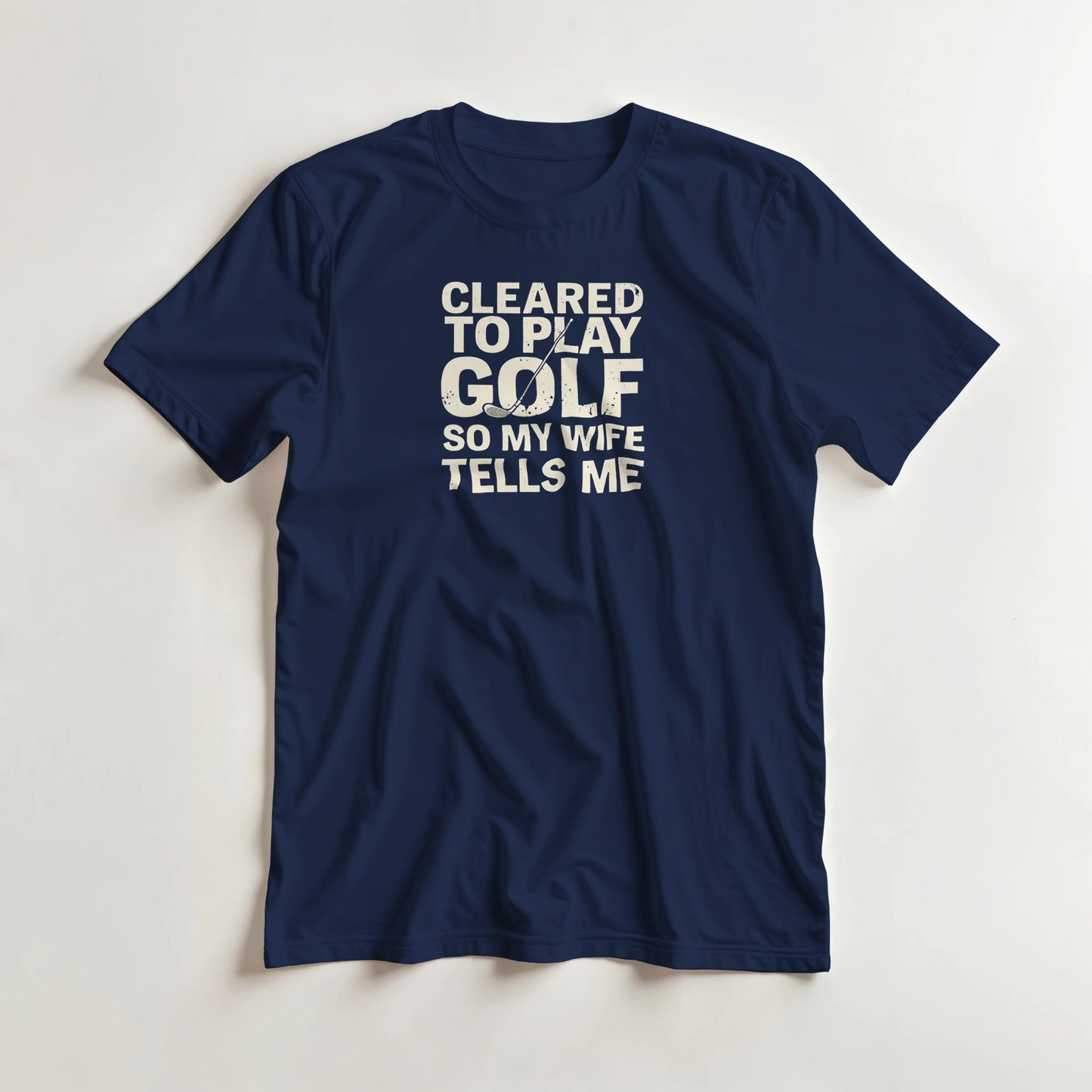 Cleared T-Shirt in Navy lying on a plain floor. T-shirt is a unisex cut and 100 per cent cotton.