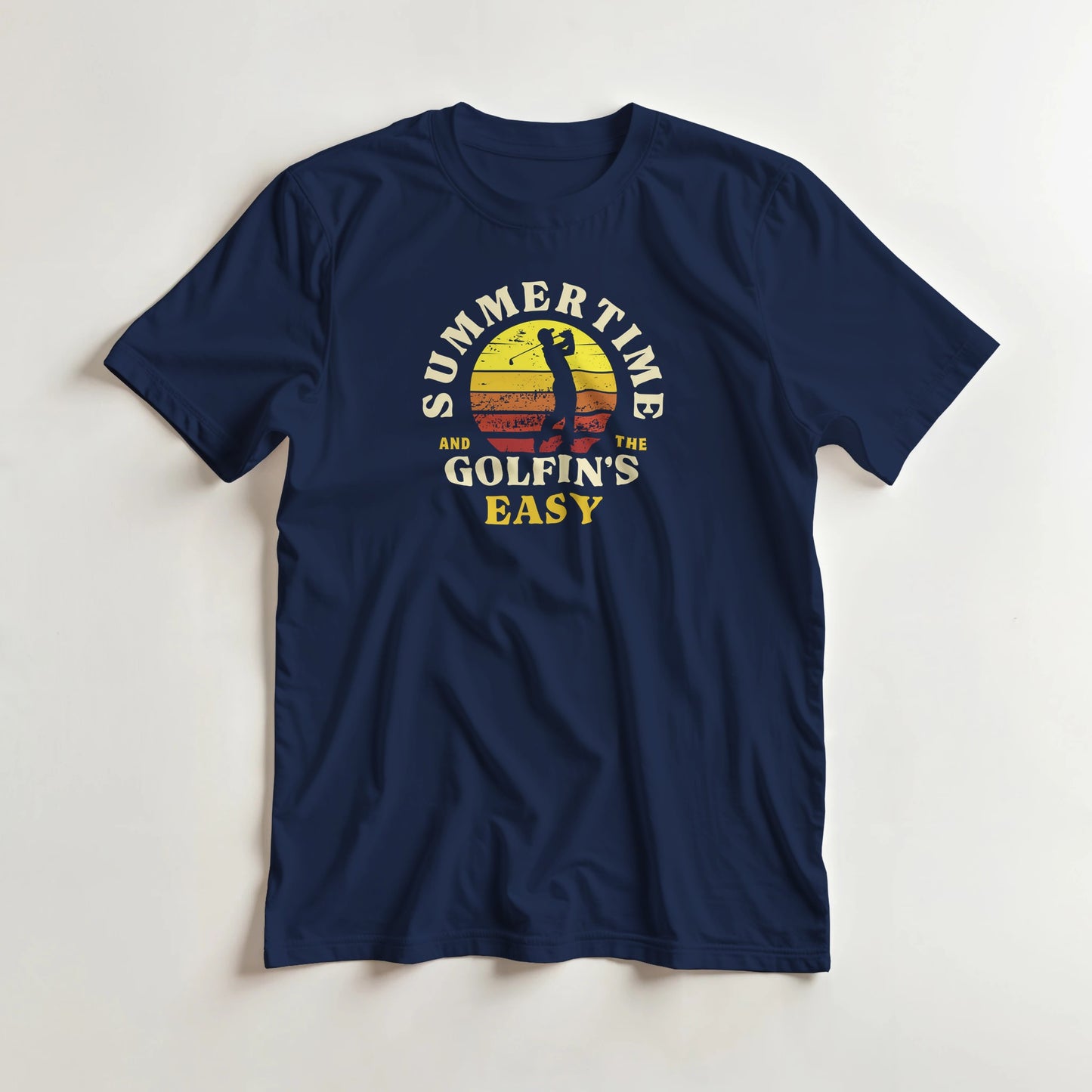 Summertime T-Shirt in Navy lying on a plain floor. T-shirt is a unisex cut and 100 per cent cotton.