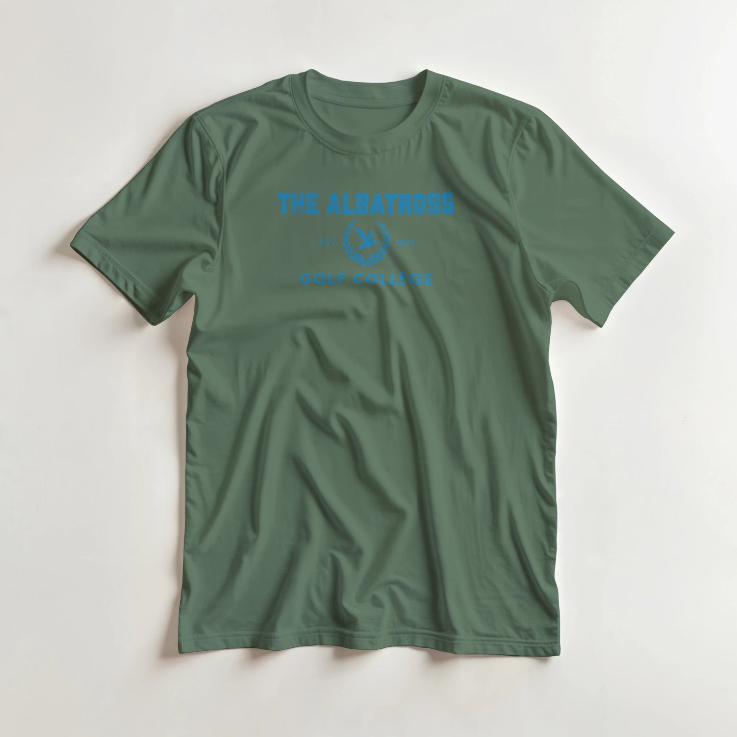Albatross College T-Shirt in Military Green 3XL lying on a plain floor. T-shirt is a unisex cut and 100 per cent cotton.