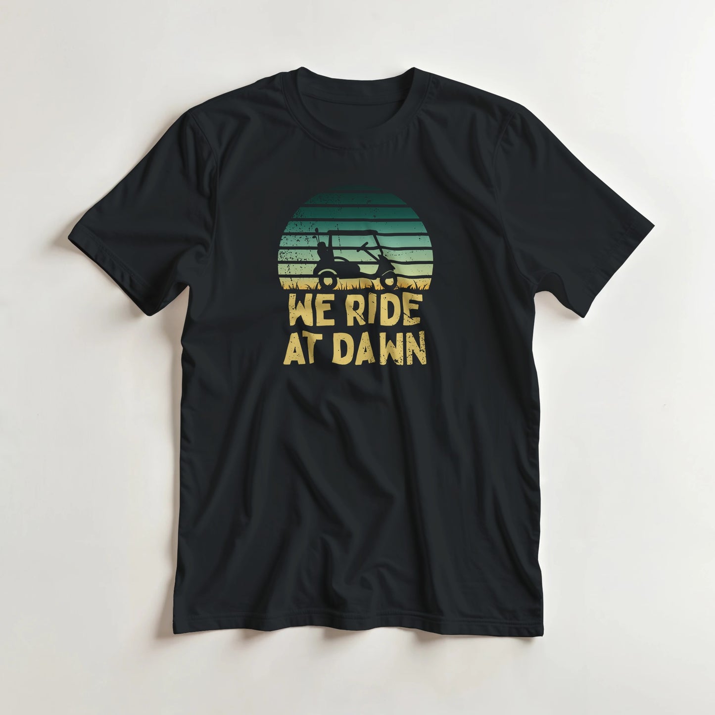 Ride At Dawn T-Shirt in Black lying on a plain floor. T-shirt is a unisex cut and 100 per cent cotton.