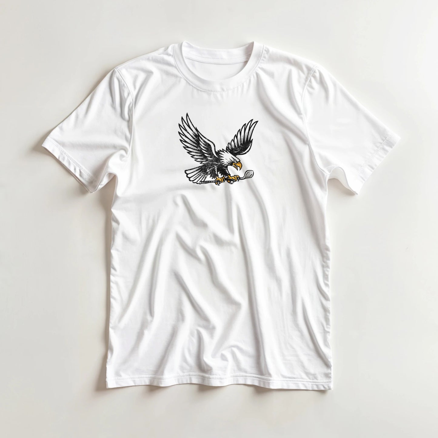 Eagle Flight T-Shirt in White lying on a plain floor. T-shirt is a unisex cut and 100 per cent cotton.