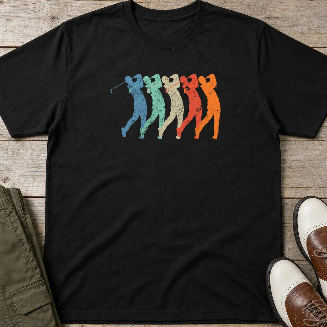Golf Swing T-Shirt in Black lying on a plain floor. T-shirt is a unisex cut and 100 per cent cotton.