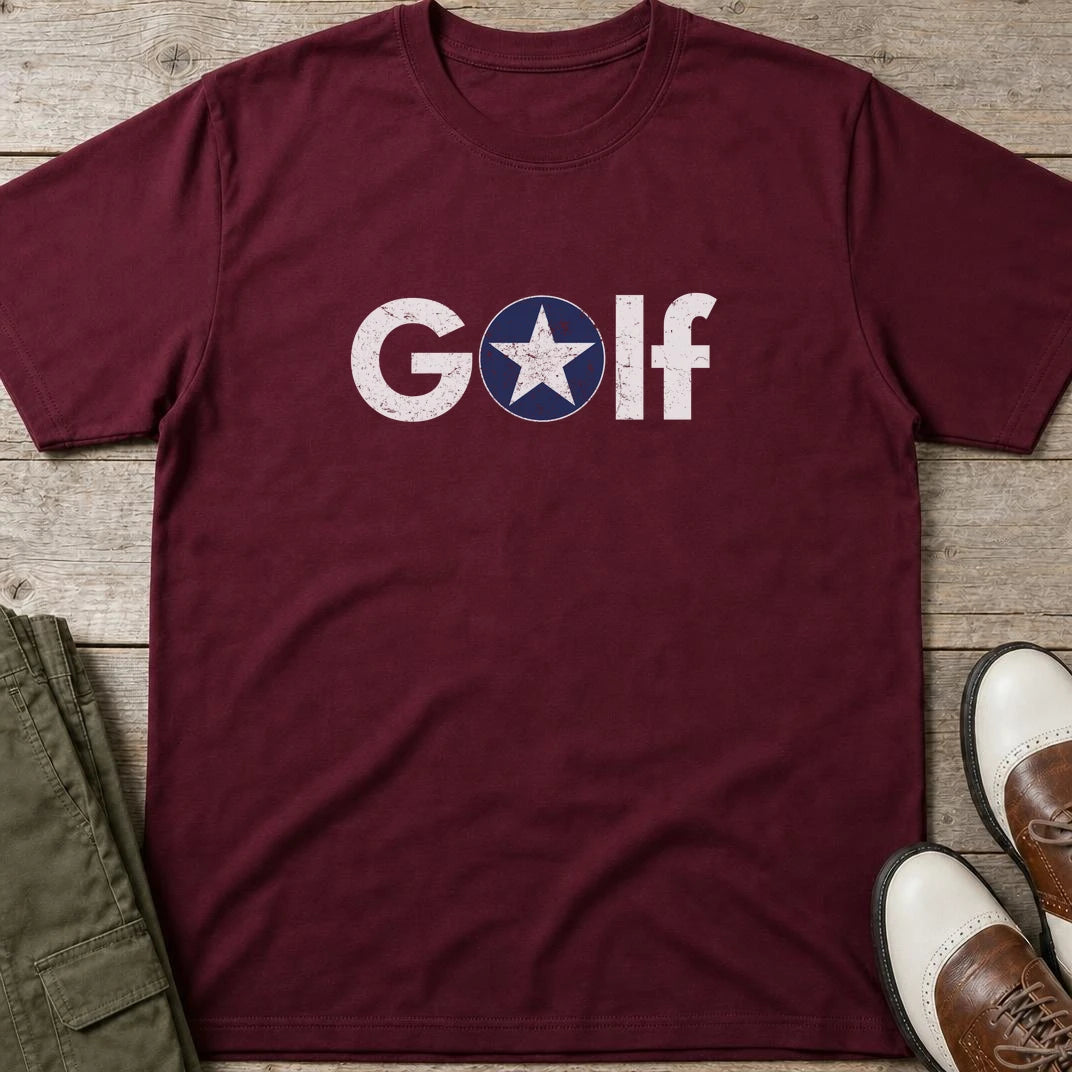 Golf Star T-Shirt in Maroon lying on a plain floor. T-shirt is a unisex cut and 100 per cent cotton.