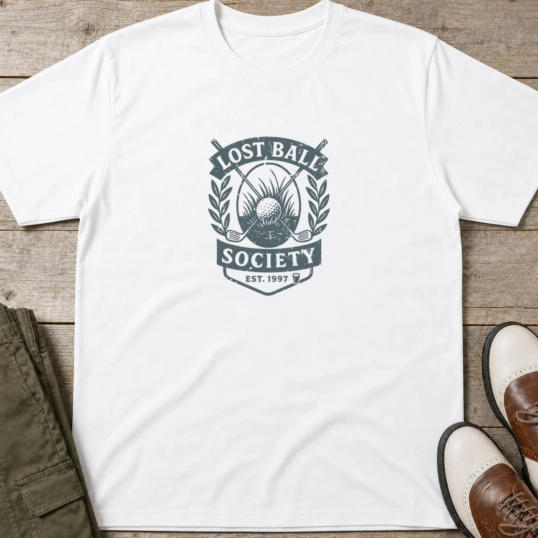 Lost Ball Society T-Shirt in White lying on a plain floor. T-shirt is a unisex cut and 100 per cent cotton.