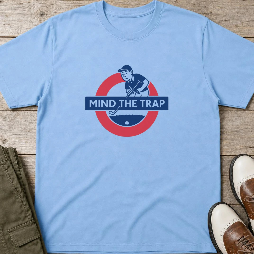 Mind The Trap T-Shirt in Light Blue lying on a plain floor. T-shirt is a unisex cut and 100 per cent cotton.