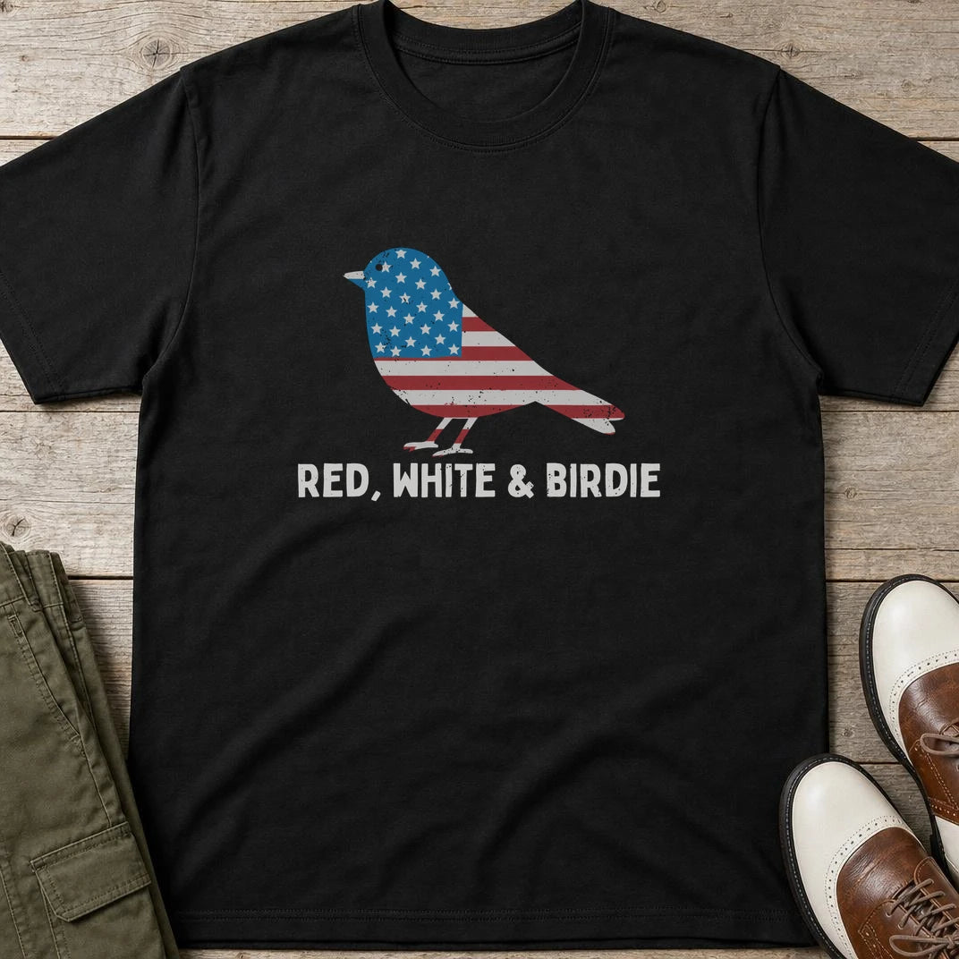 Red White Birdie T-Shirt in Black lying on a plain floor. T-shirt is a unisex cut and 100 per cent cotton.