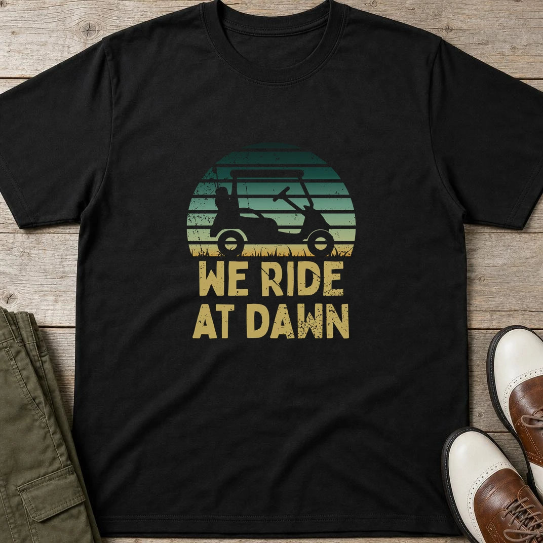 Ride At Dawn T-Shirt in Black lying on a plain floor. T-shirt is a unisex cut and 100 per cent cotton.