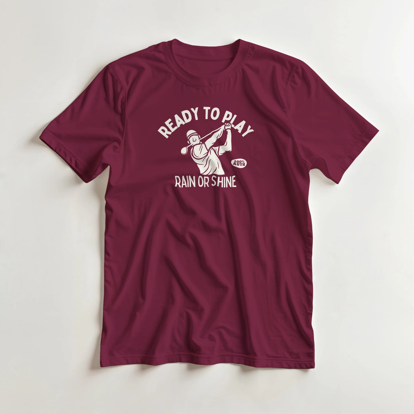 Ready To Play T-Shirt in Maroon L lying on a plain floor. T-shirt is a unisex cut and 100 per cent cotton.