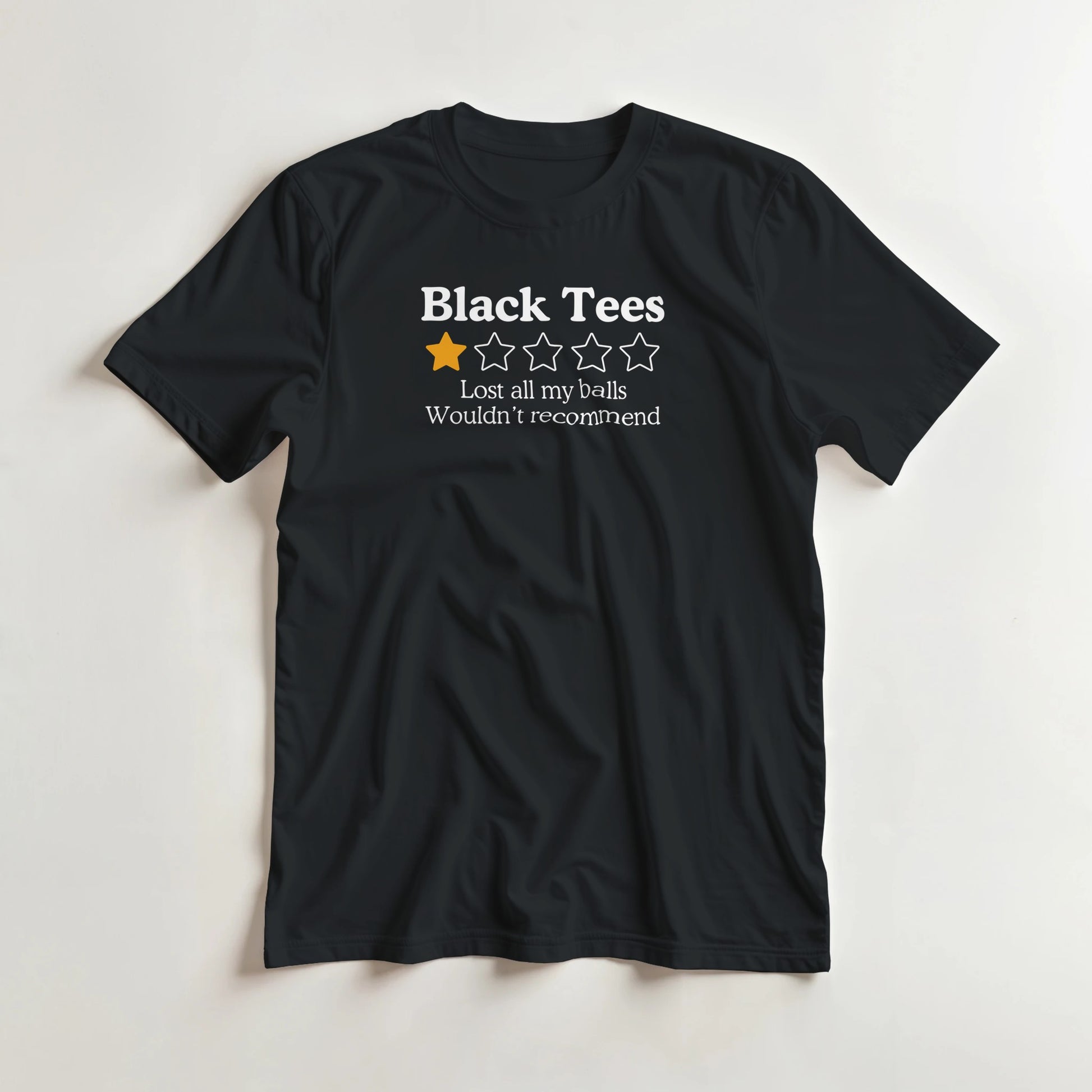Black Tees T-Shirt in Black S lying on a plain floor. T-shirt is a unisex cut and 100 per cent cotton.